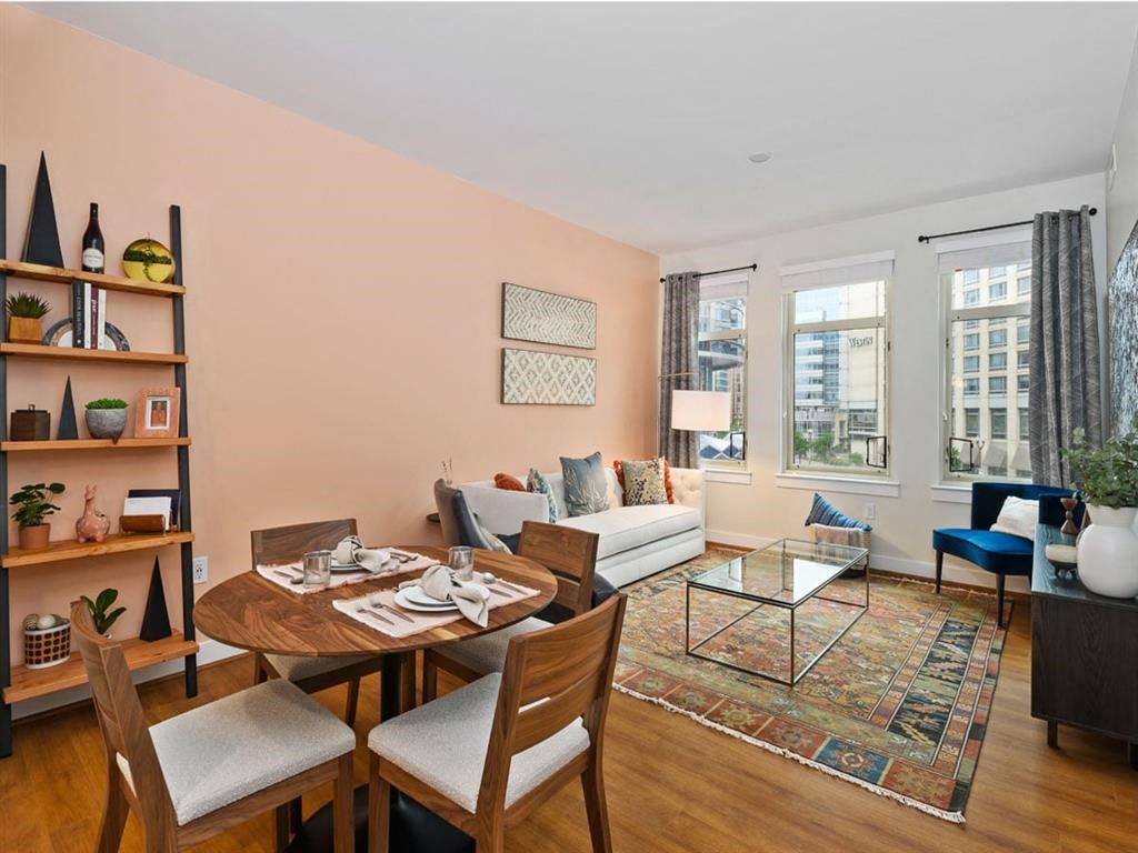 a living room with a dining room table and a couch