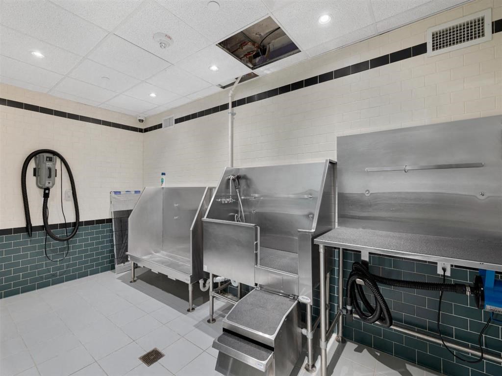 the kitchen is equipped with stainless steel appliances