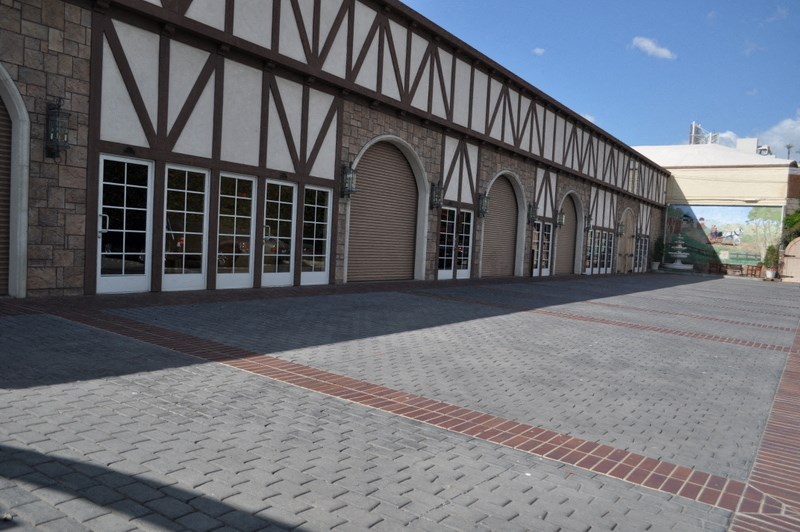 the outside of a building with a brick courtyard