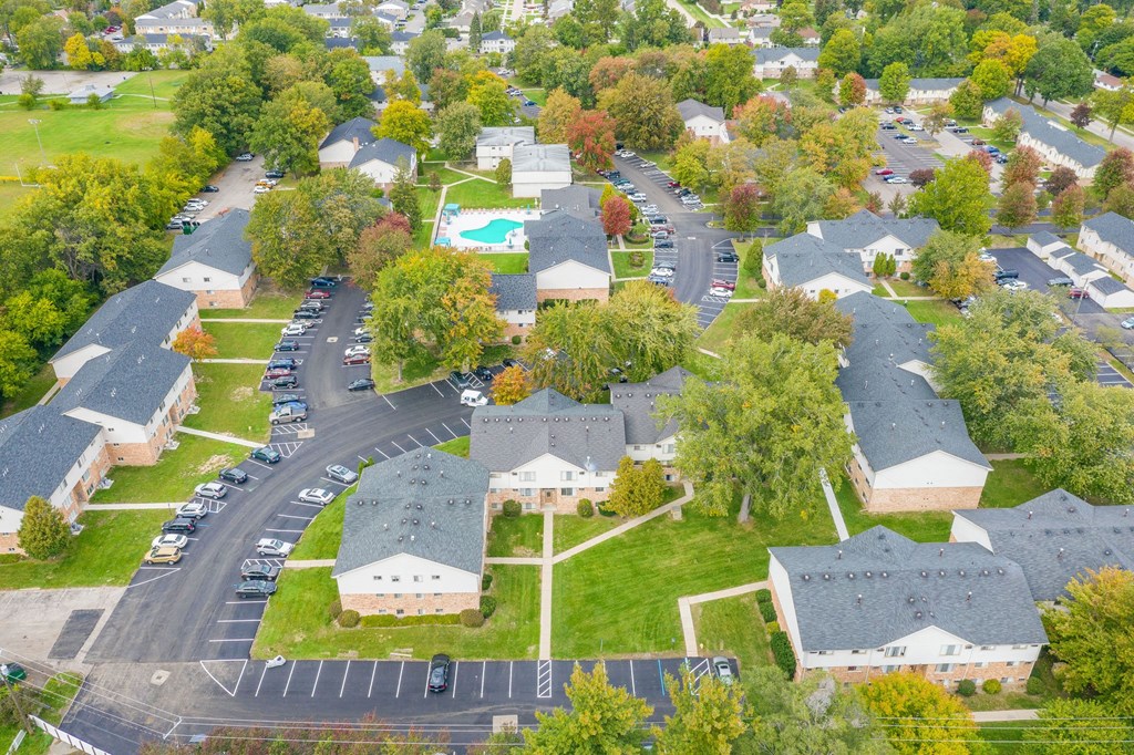 an aerial view of a neighborhood with houses and trees