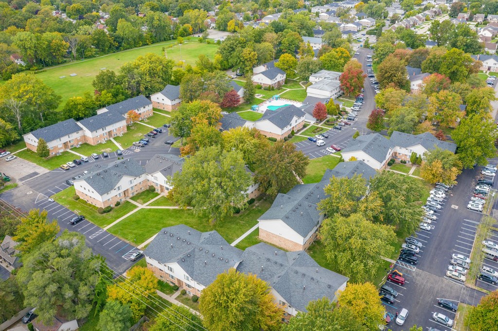 an aerial view of a neighborhood with houses and trees
