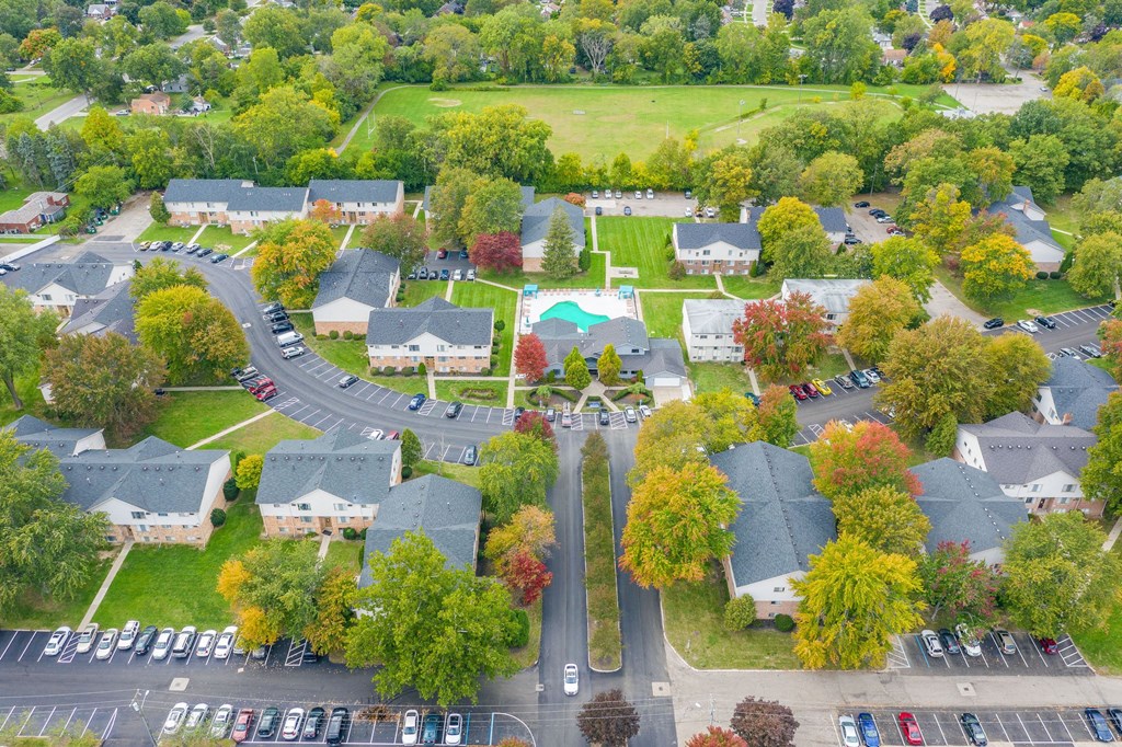 an aerial view of a neighborhood with houses and trees