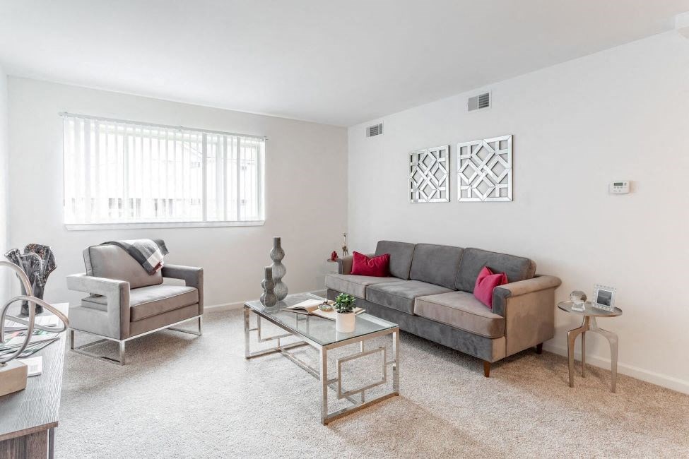 a living room with a couch and a table