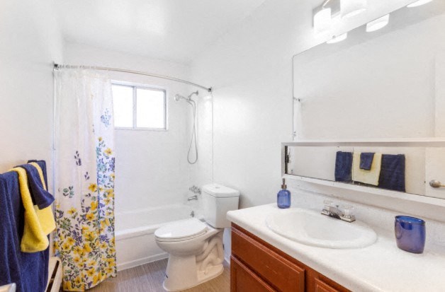 a bathroom with a sink toilet and a shower