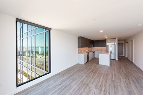 Contemporary Living Room With Large Windows at 10 Clay Apartments in Seattle, WA
