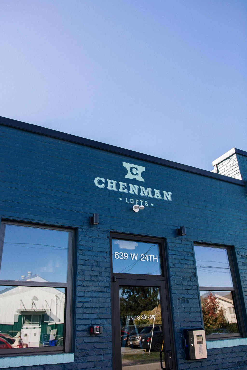 a blue building with a sign that reads logos