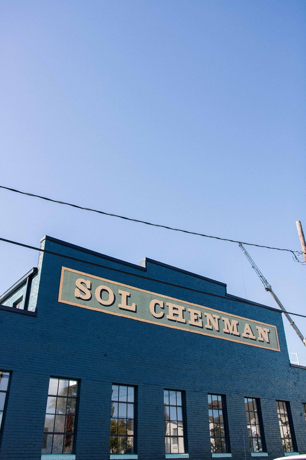 a sign on the side of a brick building