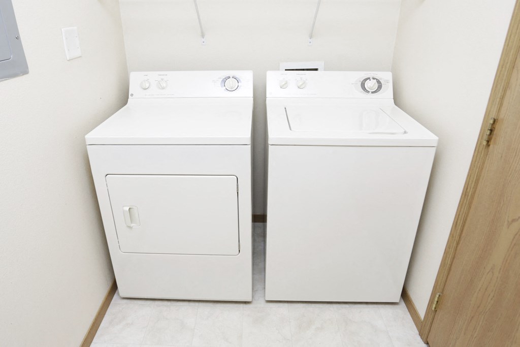 a washer and dryer in a room with a door