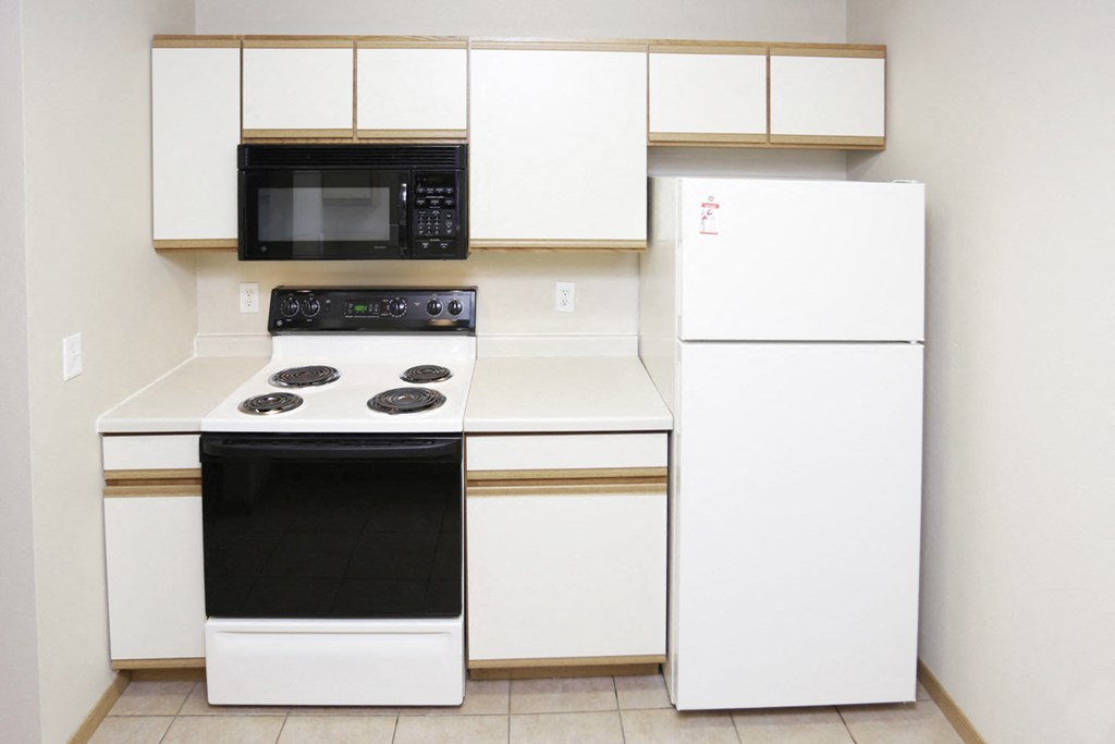a kitchen with a stove microwave and refrigerator
