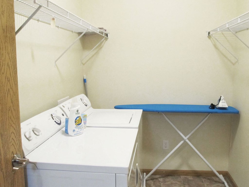 a small laundry room with a washer and dryer