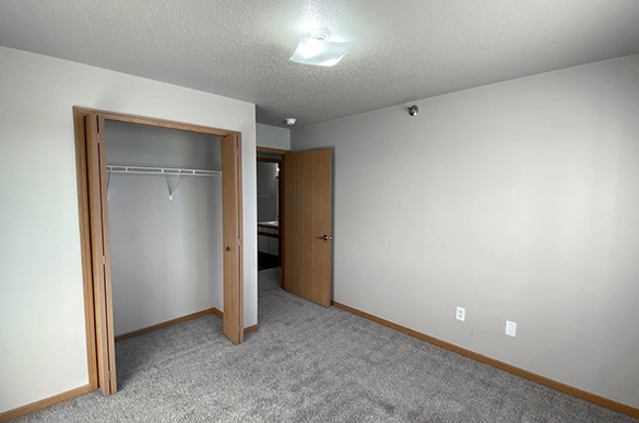 Guest bedroom in Osgood Townsite, Fargo ND, with carpet flooring