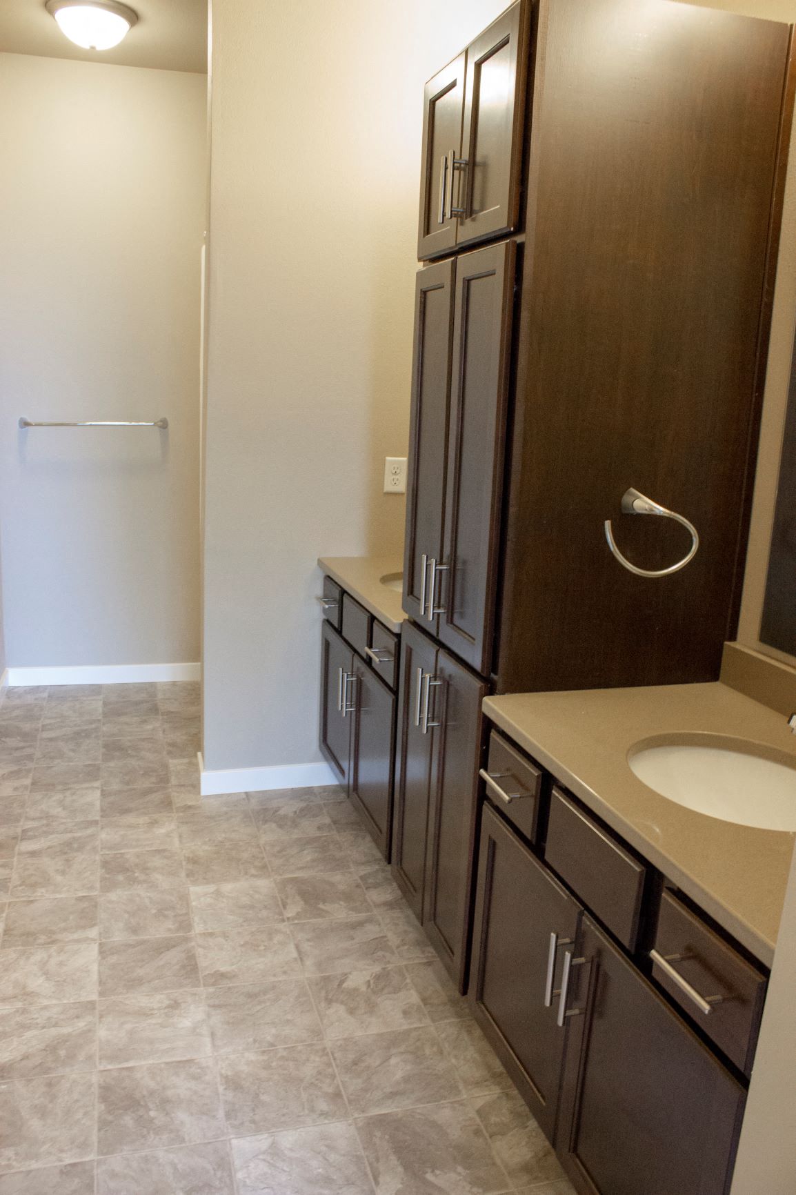 Double sink bathroom with two vanities at South Beach apartments in Bemidji, Minnesota.