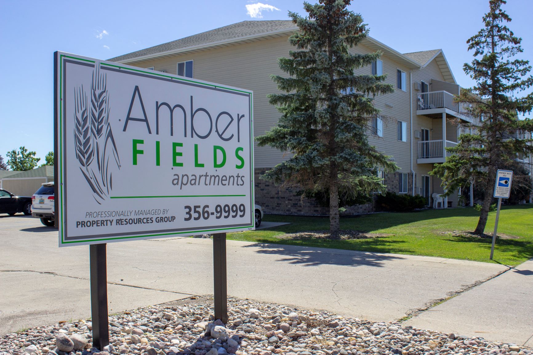 Amber Fields sign and exterior view of the front of the building
