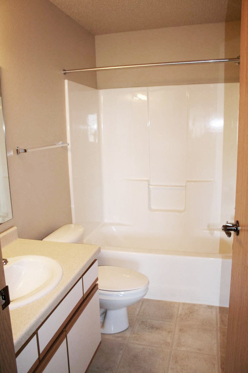 a bathroom with a toilet and a sink and a shower