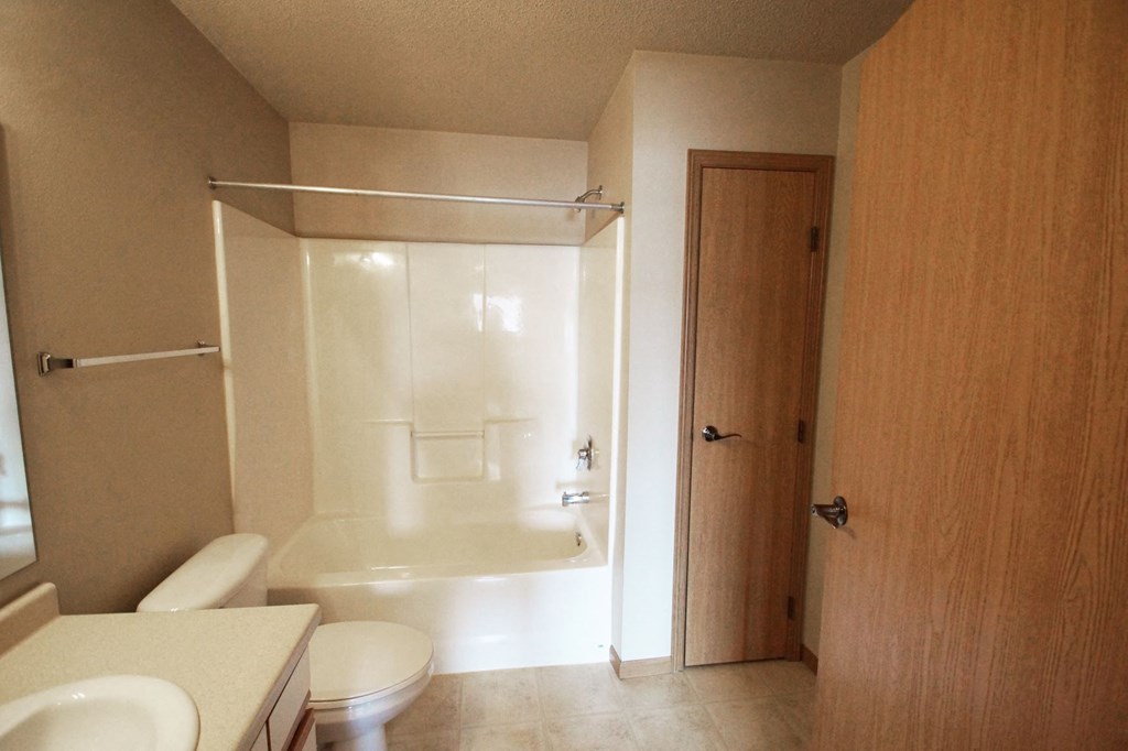 a bathroom with a sink toilet and a shower