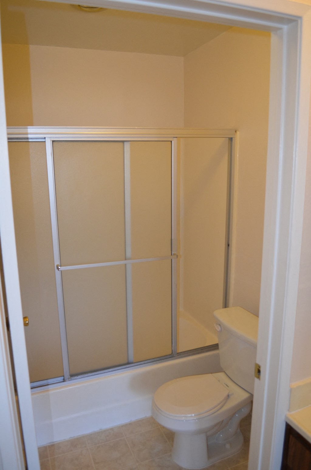 a small bathroom with a toilet and a shower