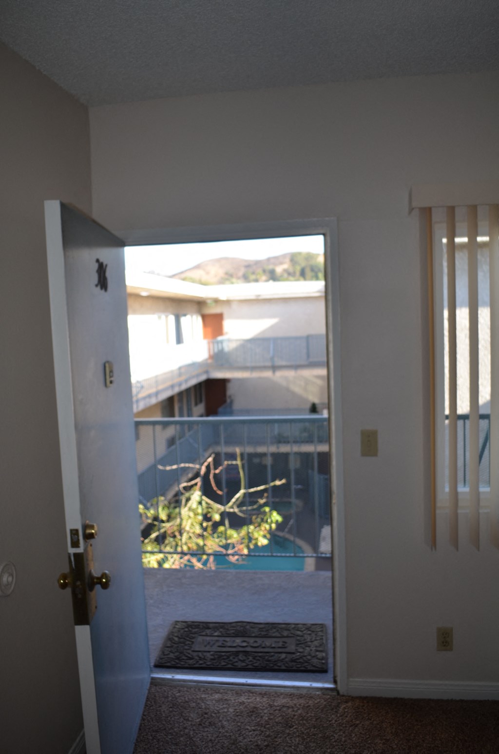 an open door with a view of a balcony