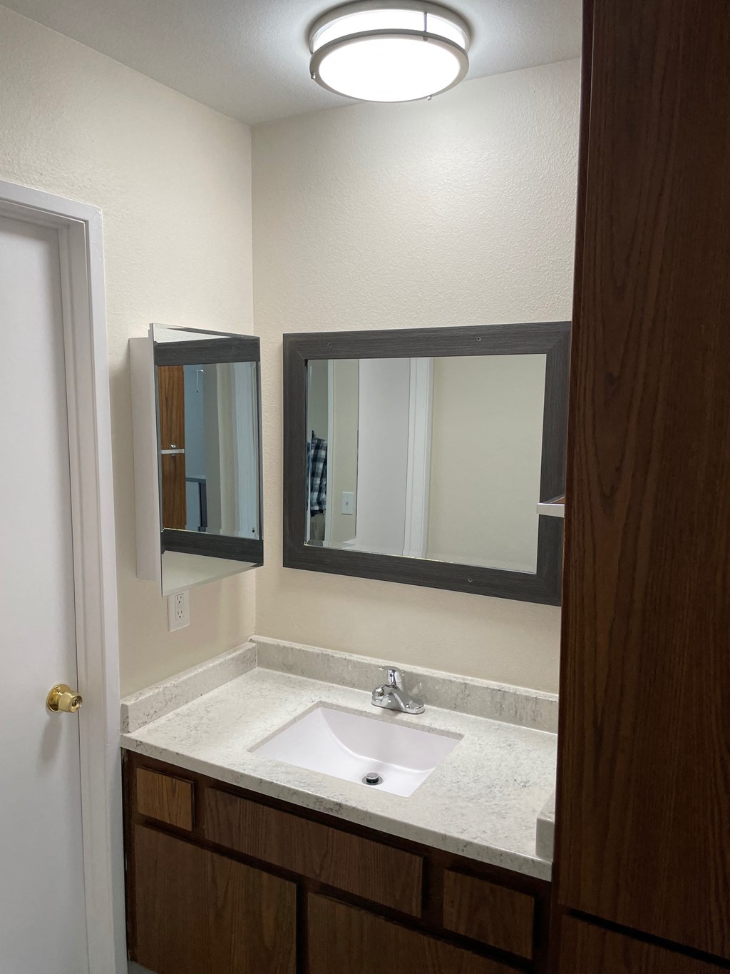 a small bathroom with a sink and a mirror