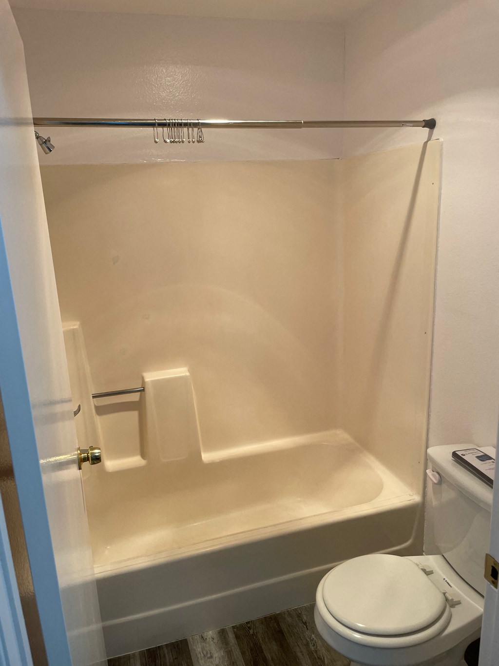 a small bathroom with a toilet and a shower