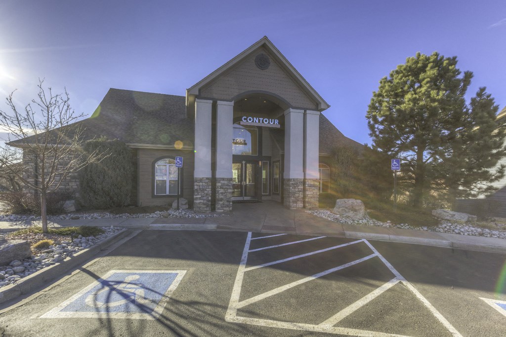 an empty parking lot in front of a church building