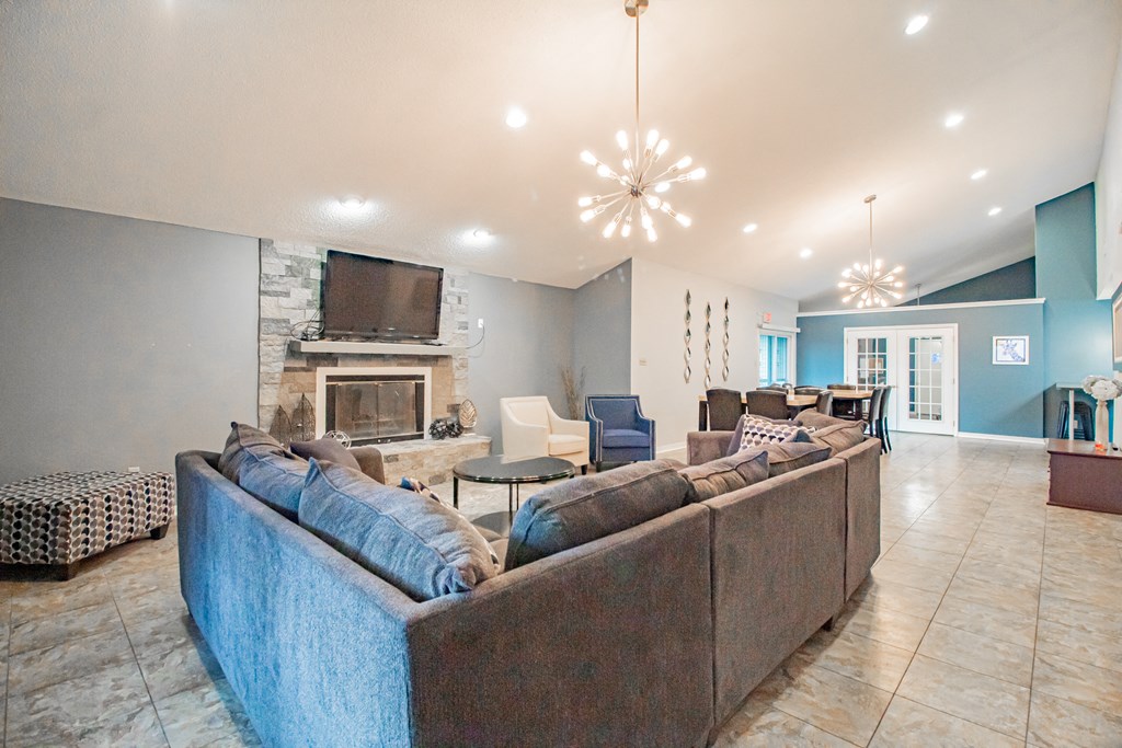 a living room with a couch and a fireplace