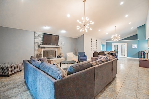 a living room with a couch and a fireplace
