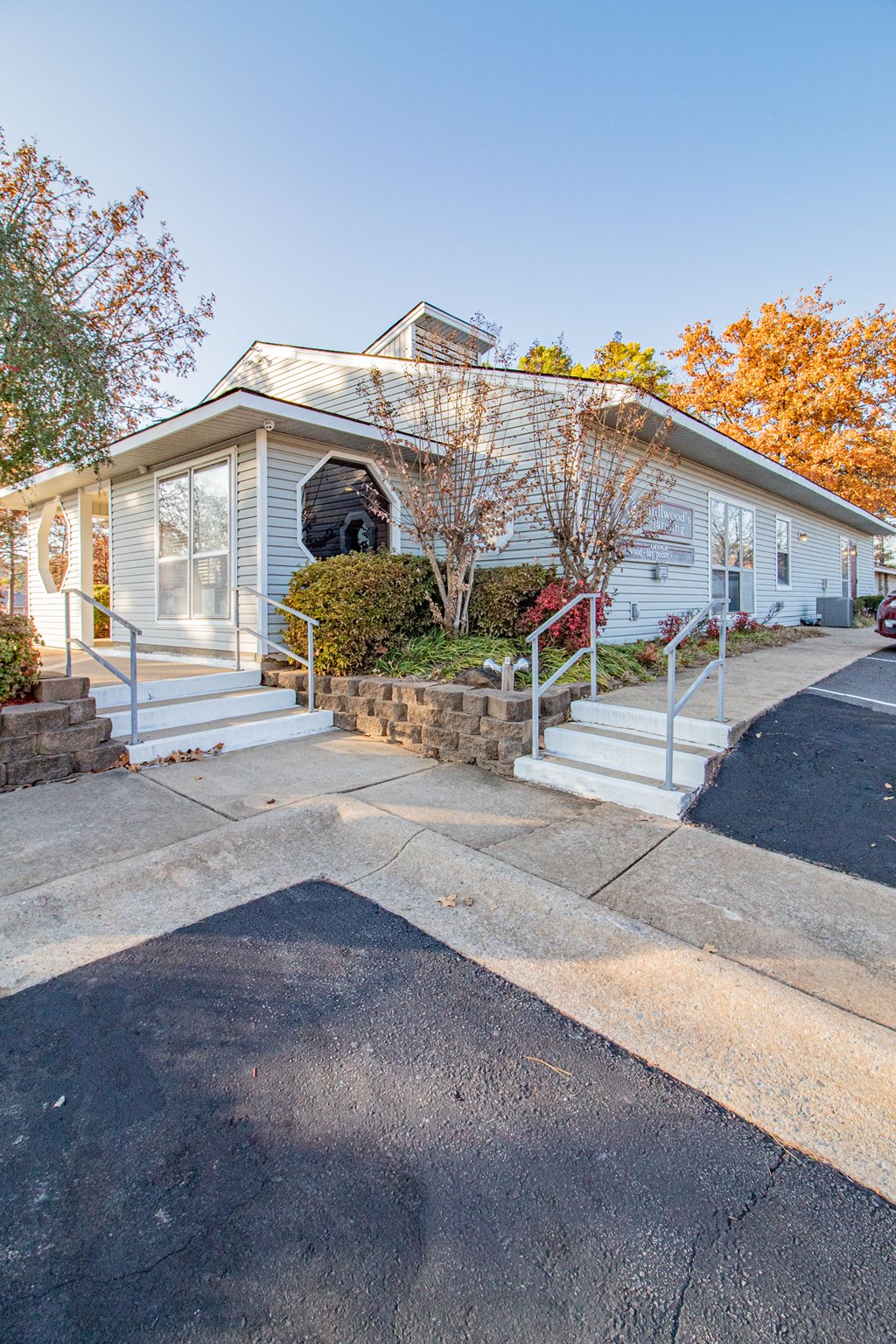 a small blue house with stairs in front of it