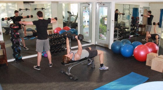 a group of people working out in a gym