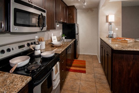 a kitchen with a stove and a microwave