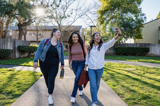 Residents walk near the office at Casitas and Chautauqua