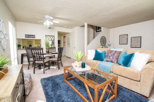 a living room with a couch and a table
