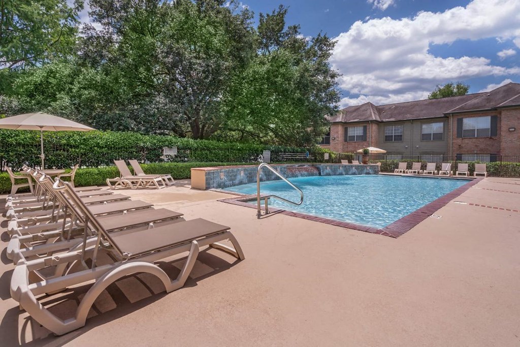 our apartments have a resort style pool and lounge chairs