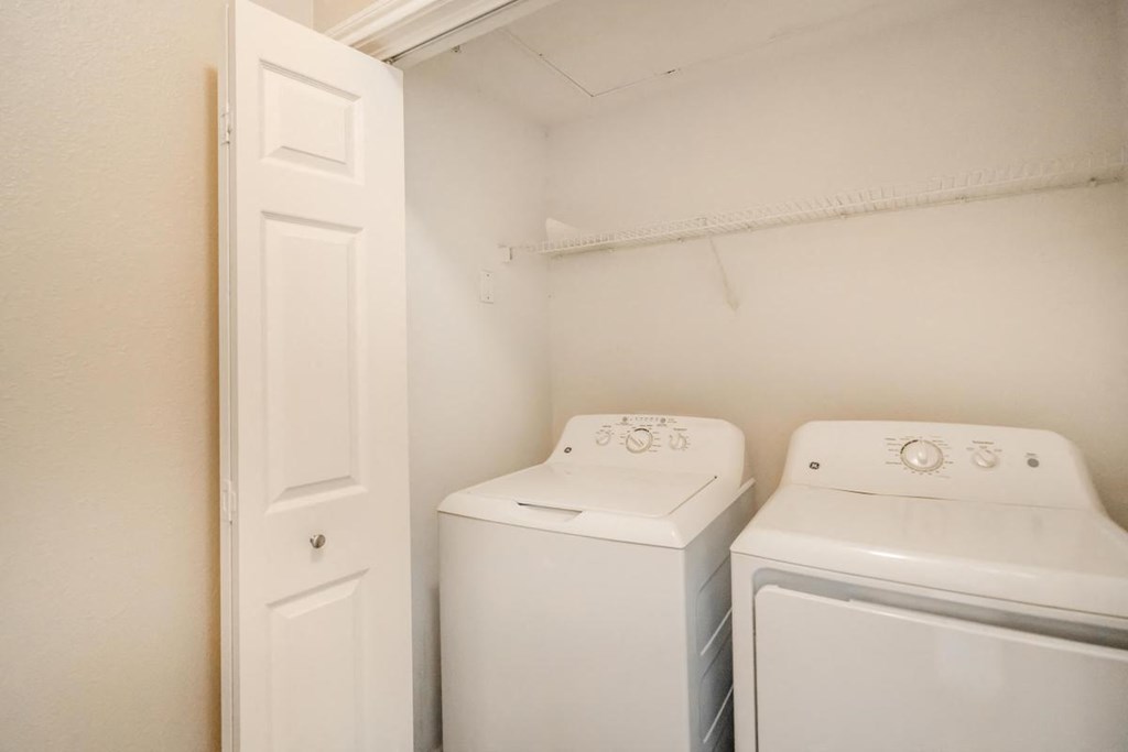 a washer and dryer in a room with a door