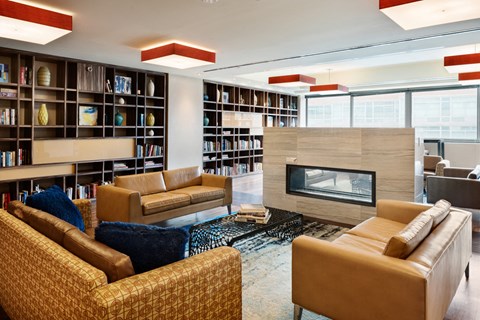 a living room filled with furniture and a fireplace