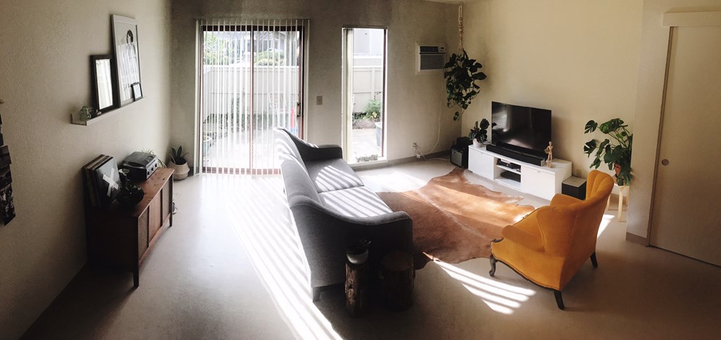 a living room with a couch and a tv