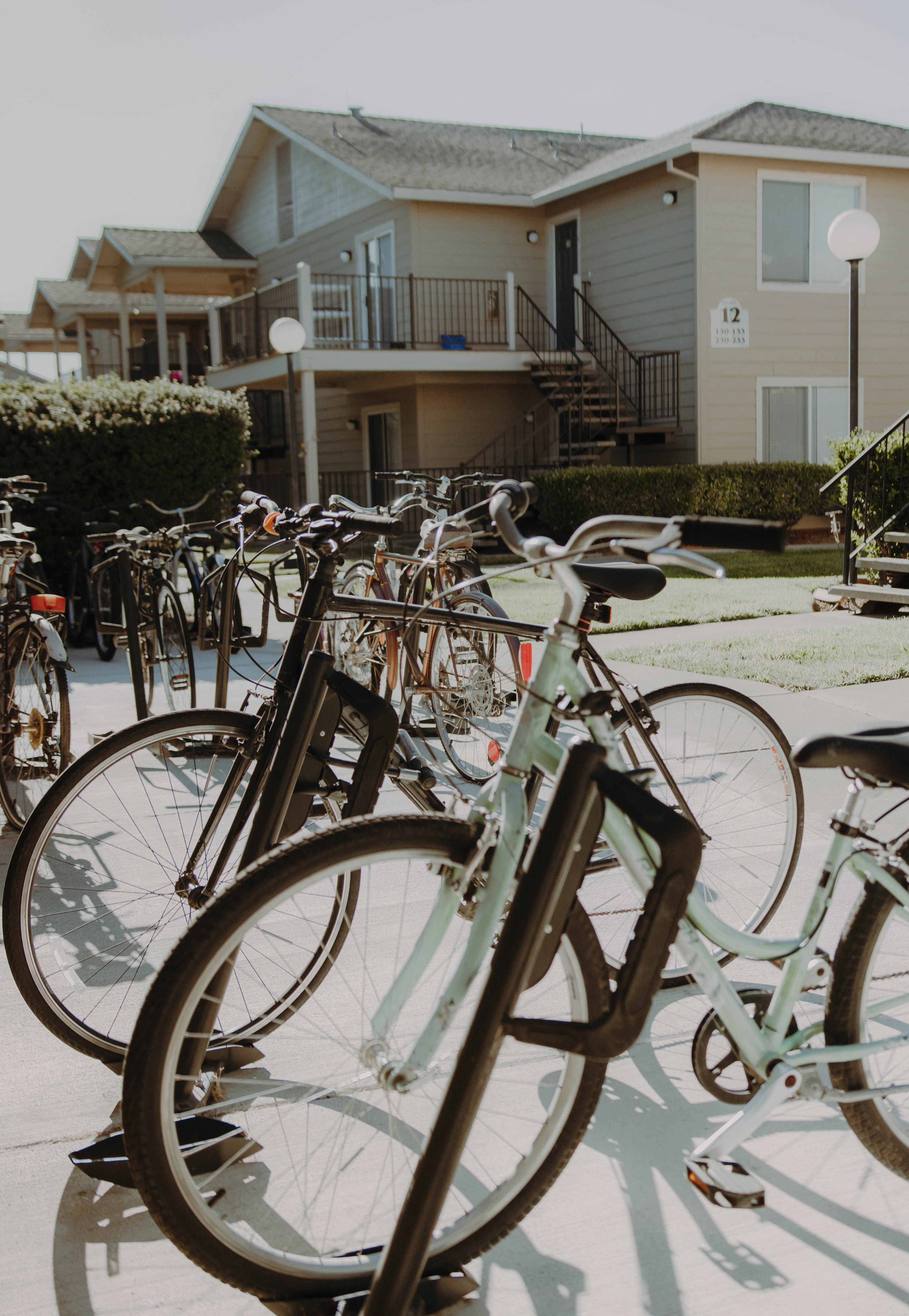 a row of bikes parked in front of a house