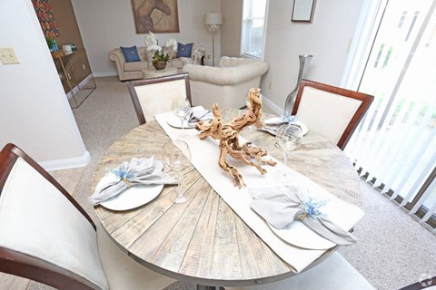 a dining room table set with seashells on top of it