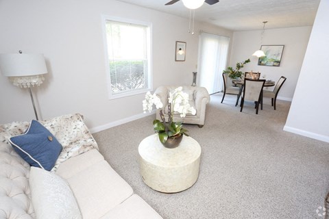 a living room with a couch and a table