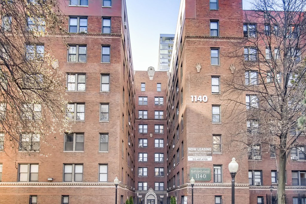 a view of several tall buildings in a city