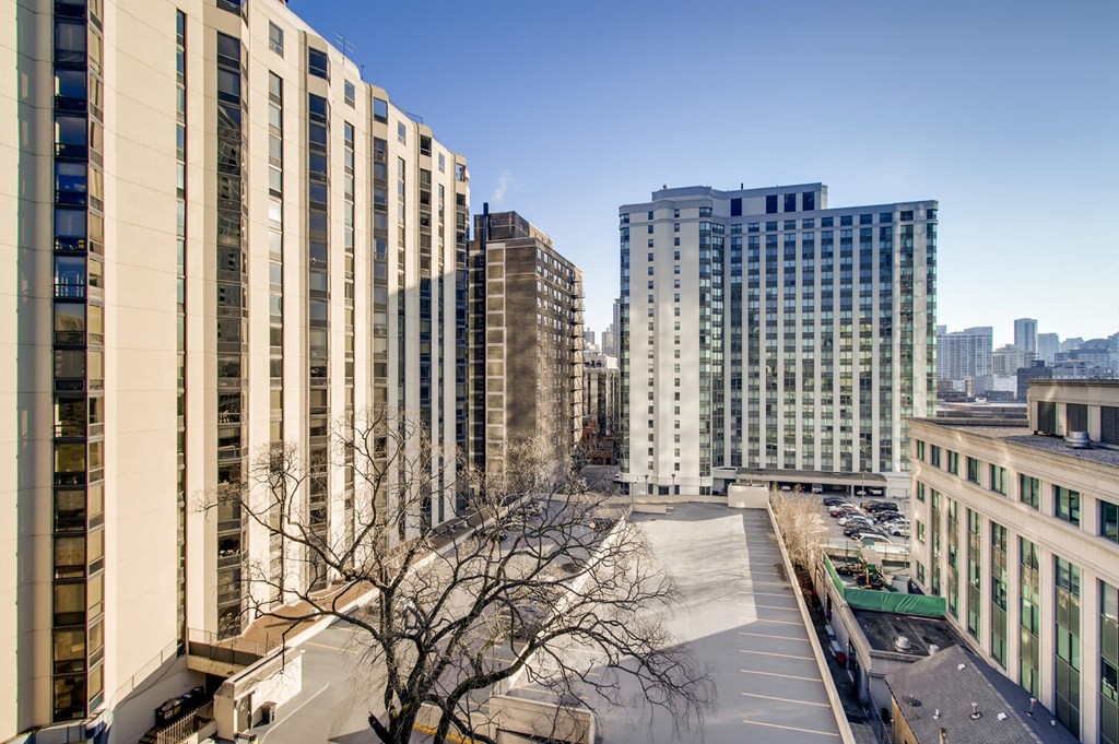a view of the city from the balcony of a building