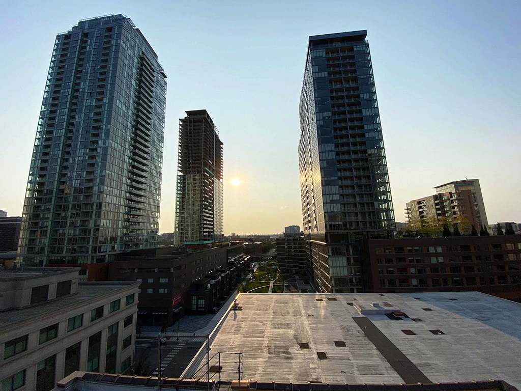the view of the city from the roof of a building