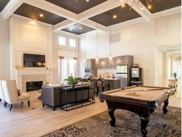 Club room with pool table, kitchen and fire place