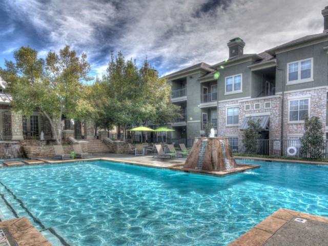 Swimming pool with outdoor lounge chairs