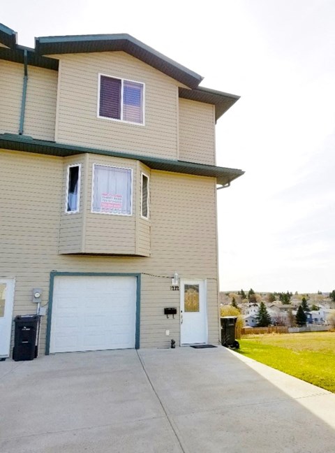 a house with a driveway and a garage door