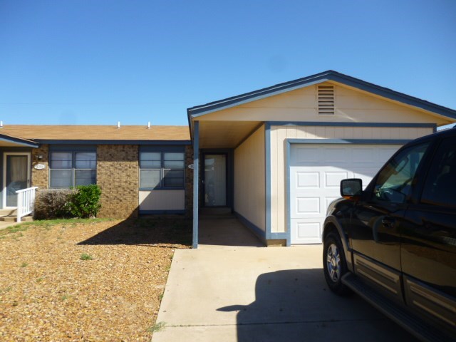 a house with a car parked in front of it