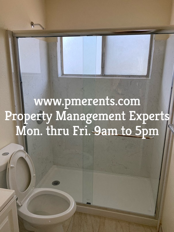 a small bathroom with a shower and a toilet