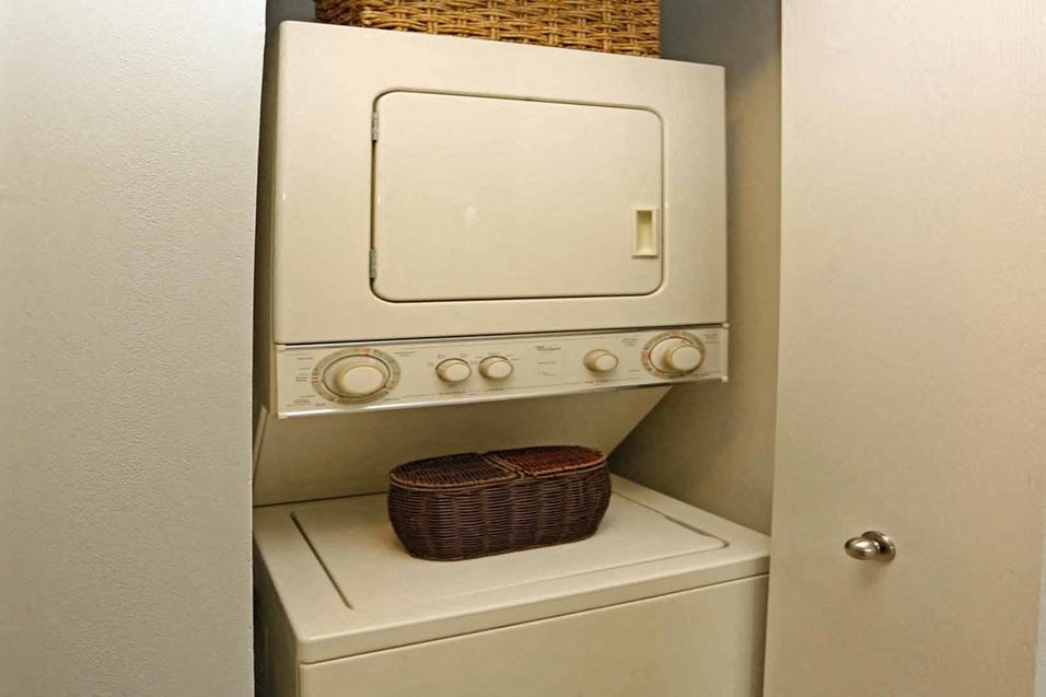 a washer and dryer in a small laundry room