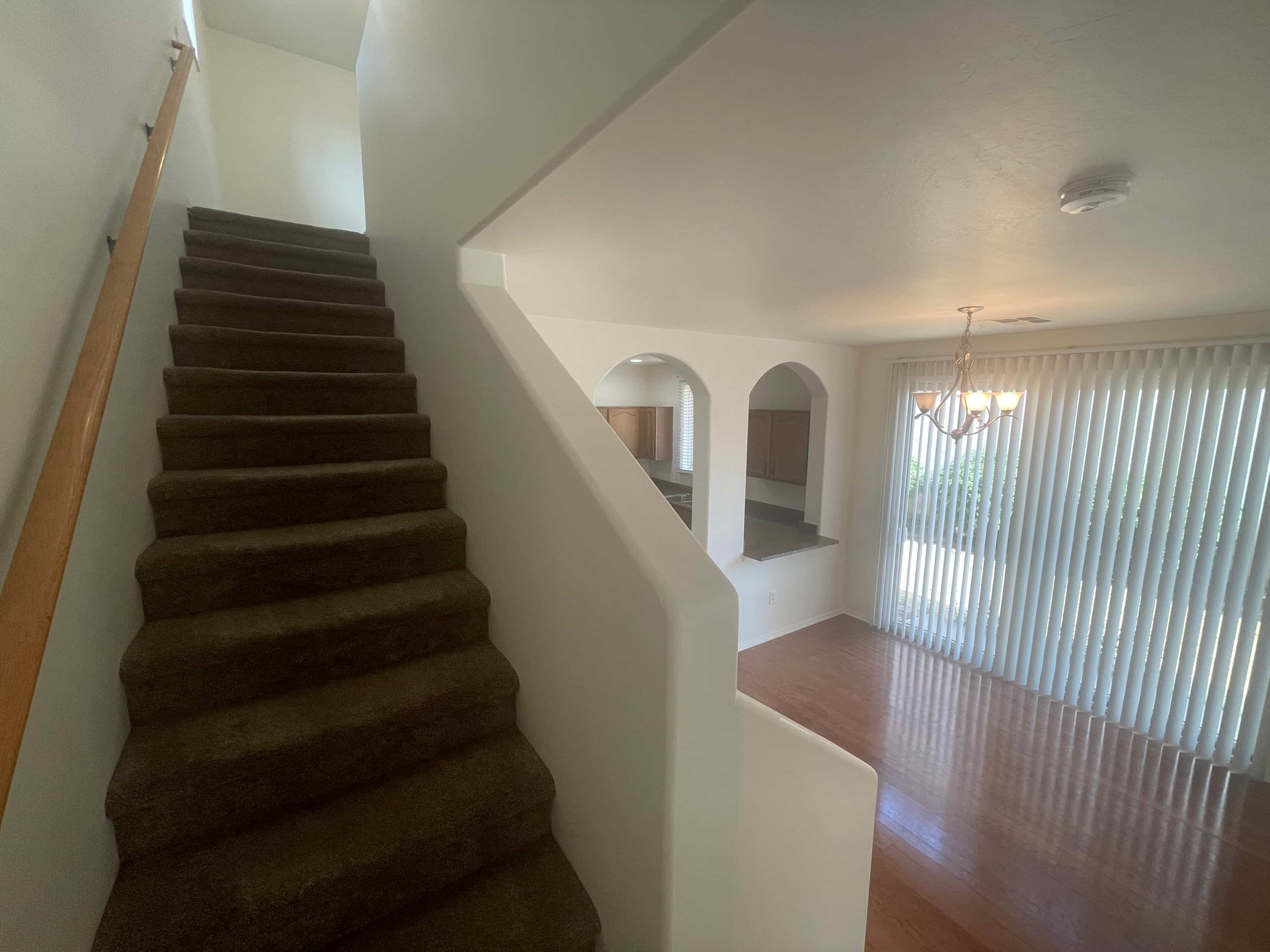 a view of a staircase in a house from the bottom of it