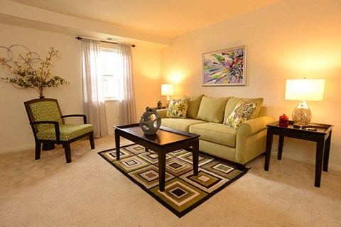 a living room with a couch and a table