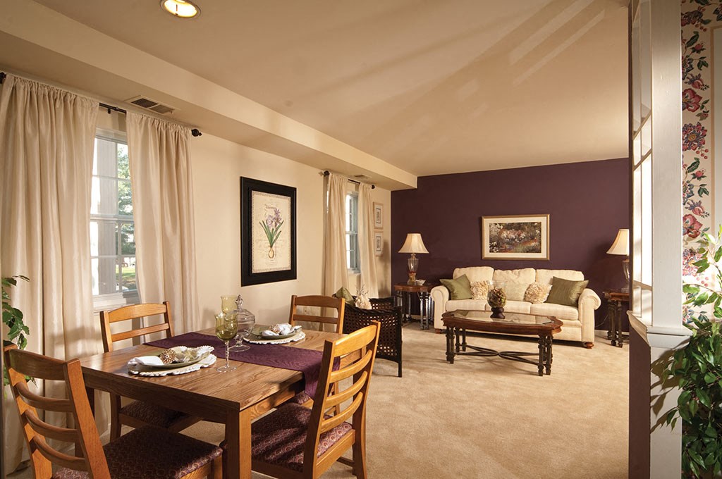 a living room and dining room with a couch and a table